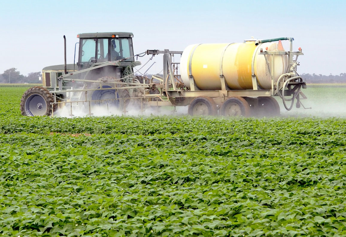 Spraying pesticides on crops